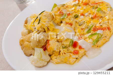 Omelette with cauliflowers 129455211
