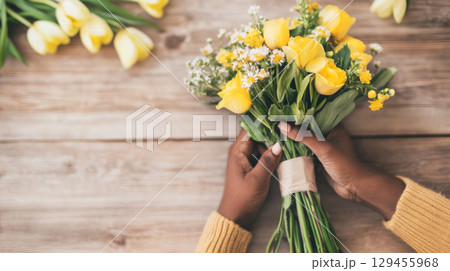 Bouquet of stunning flowers held by African American woman, Mothers day concept postcard 129455968