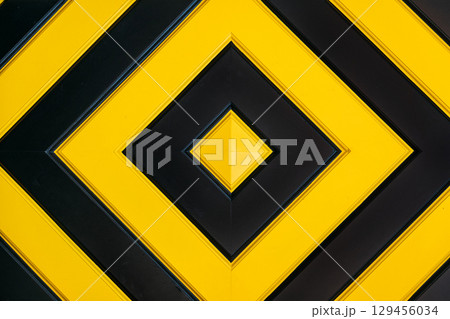 Geometric pattern featuring alternating black and yellow diamond shapes in a symmetrical layout. Visual abstraction, color theory, modern design, geometric minimalism Geometric pattern featuring alternating black and yellow diamond shapes in a symmetrical layout. Visual abstraction, color theory, modern design, geometric minimalism 129456034