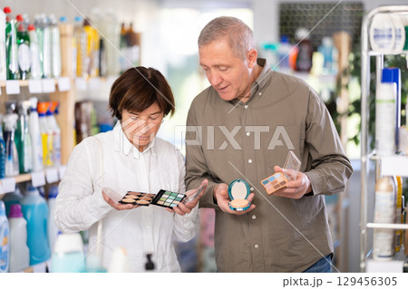 Couple man and woman choosing cosmetics in store 129456305