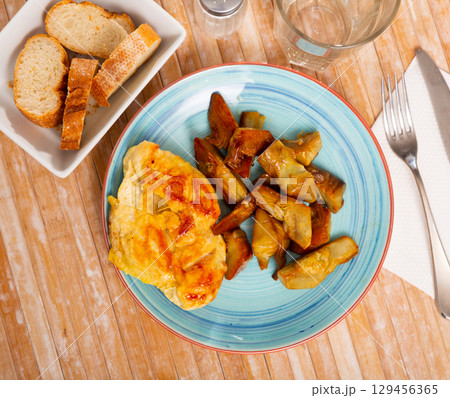Grilled chicken fillet with artichokes Grilled chicken fillet with artichokes 129456365