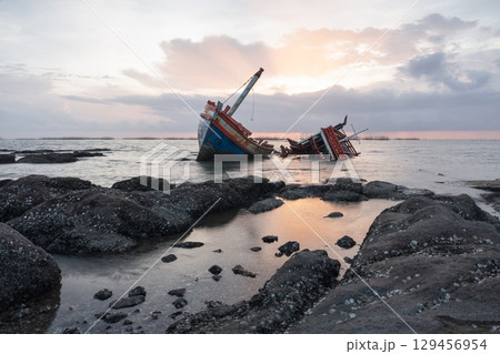 Old wrecked fishing boat on coast of Ang Sila Village, Saensuk Sub-district, Chonburi Province of thailand. 129456954