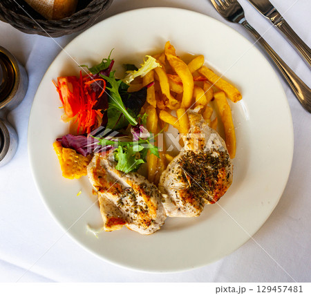 Savory grilled chicken fillets Savory grilled chicken fillets 129457481