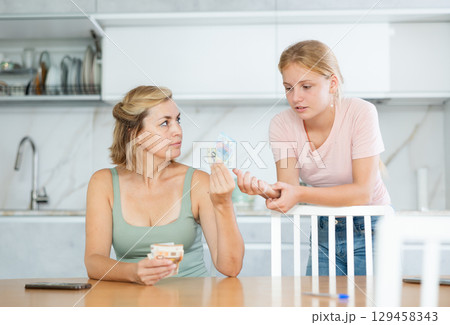 Woman received salary giving pocket money to teenage daughter 129458343