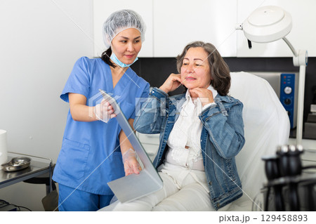 Woman satisfied with results of cosmetic procedures Woman satisfied with results of cosmetic procedures 129458893