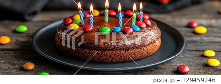 Celebrate Birthday With Chocolate Cake, Candles and Colorful Candies Decorate Cake 129459246