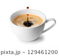Coffee splash with drop inside ceramic espresso cup isolated on white background 129461200