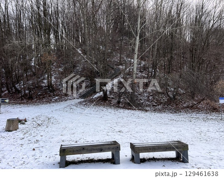 Aerial view to hiking trail in winter bog and forest snow covered in Estonia 129461638