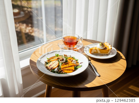 Autumn Persimmon Salad with Pumpkin Pie and Tea Autumn Persimmon Salad with Pumpkin Pie and Tea 129462385