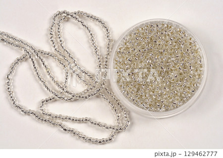 Tiny silver seed beads Tiny silver seed beads 129462777