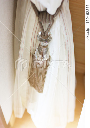 Closed up curtains and detail of interior design 129462833