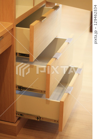 Open the modern cabinet drawer in furniture shop Open the modern cabinet drawer in furniture shop 129462834