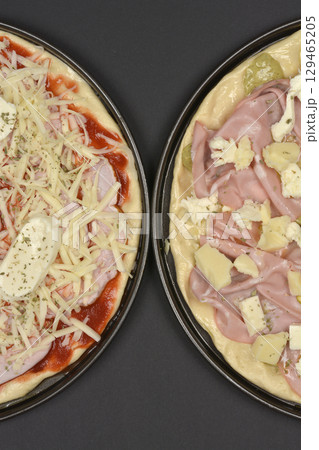 Unbaked pizzas Unbaked pizzas 129465205