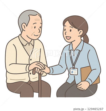 高齢者に手を添えて会話する福祉スタッフ 129465287