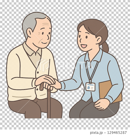 高齢者に手を添えて会話する福祉スタッフ 129465287