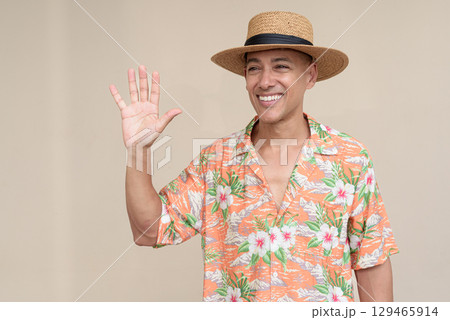 Tourist man greeting and waving hand Tourist man greeting and waving hand 129465914