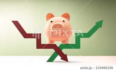 Piggy bank stands on intersecting red green arrows, reflecting the volatility of global markets, financial uncertainty, and impact of global economic shifts, trade wars and geopolitical conflicts Piggy bank stands on intersecting red green arrows, reflecting the volatility of global markets, financial uncertainty, and impact of global economic shifts, trade wars and geopolitical conflicts 129466290