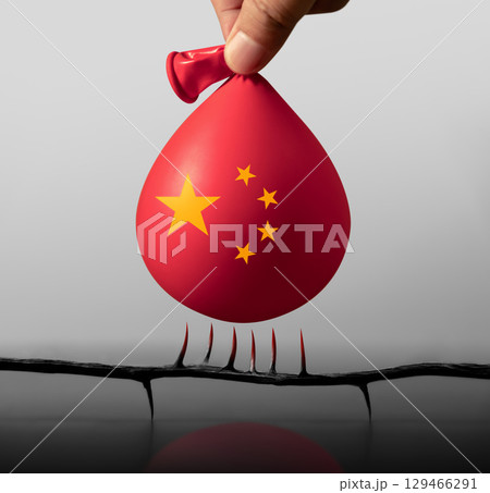Balloon with China flag floats near sharp spikes, representing looming financial risks in China, economic downturn and investment uncertainty Balloon with China flag floats near sharp spikes, representing looming financial risks in China, economic downturn and investment uncertainty 129466291