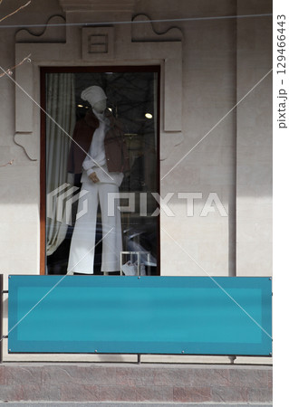 Men's mannequins in the window of a luxury store. Men's mannequins in the window of a luxury store. 129466443