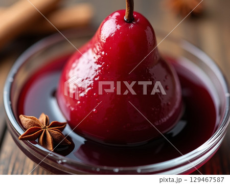 Elegant Close-up Poached Red Pear with Star Anise in Syrup Bowl 129467587