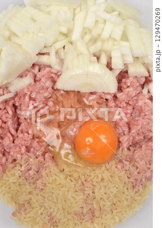 Raw mixture for stuffing peppers Raw mixture for stuffing peppers 129470269