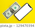 Mockup, smartphone and dollar on yellow background. 129470394