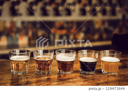 Exploring Five Unique Beer Varieties in Tasting Setup at Brewery 129471644