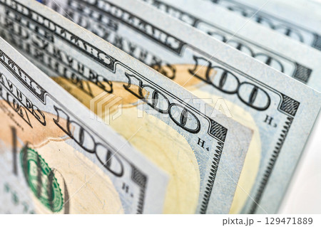 Background of US dollar bills. Pile of american cash. One hundred usd dollars banknotes 129471889