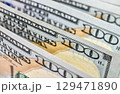 Background of US dollar bills. Pile of american cash. One hundred usd dollars banknotes 129471890