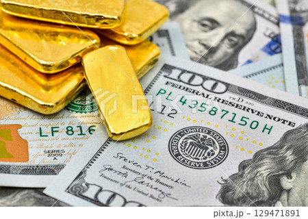 Paper us 100 dollar bill with gold bars, concept of investment and saving, wealth 129471891