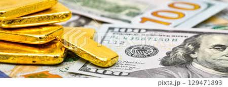 Paper us 100 dollar bill with gold bars, concept of investment and saving, wealth 129471893