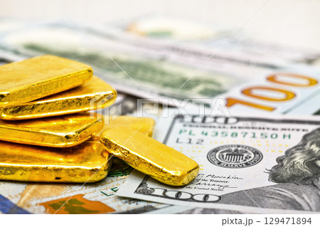 Paper us 100 dollar bill with gold bars, concept of investment and saving, wealth 129471894