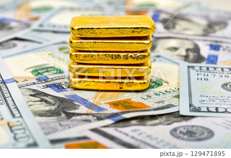 Paper us 100 dollar bill with gold bars, concept of investment and saving, wealth 129471895