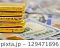 Paper us 100 dollar bill with gold bars, concept of investment and saving, wealth 129471896