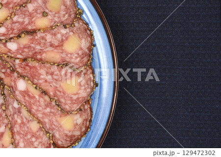 Salami with cheese and peppercorns Salami with cheese and peppercorns 129472302