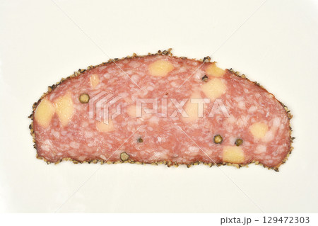 Salami with cheese and peppercorns 129472303