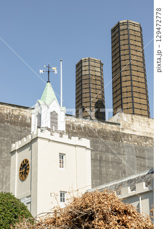 The white building in the foreground is Trinity Hospital with rectangular structures in the background are part of Greenwich Power Station. The white building in the foreground is Trinity Hospital with rectangular structures in the background are part of Greenwich Power Station. 129472778