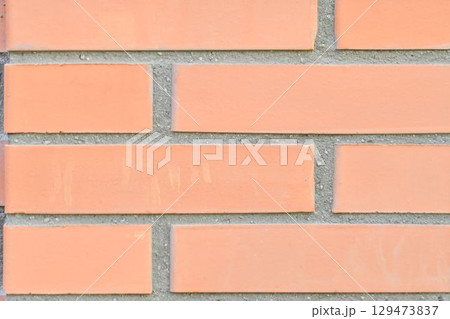 View of brick background. Brick wall. Brick base. Brick backdrop. Building and construction concept. Macro image, close-up. 129473837