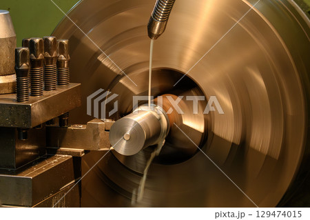 The lathe machine finish cut metal shaft parts with liquid coolant method. The lathe machine finish cut metal shaft parts with liquid coolant method. 129474015