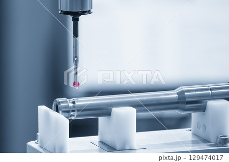 The CMM machine measuring the automotive parts in the blue tone. The CMM machine measuring the automotive parts in the blue tone. 129474017