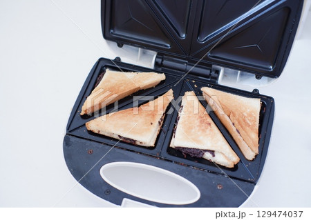 Freshly Toasted Chocolate Sandwich in a Sandwich Maker 129474037