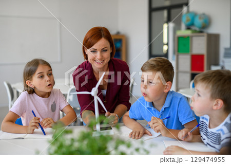 Young children learning about sustainability with teacher in classroom Young children learning about sustainability with teacher in classroom 129474955