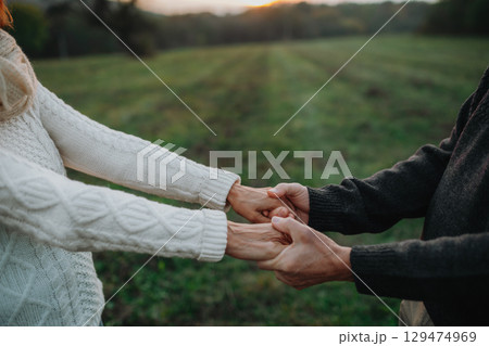 Senior couple holding hands, close up. Senior couple holding hands, close up. 129474969