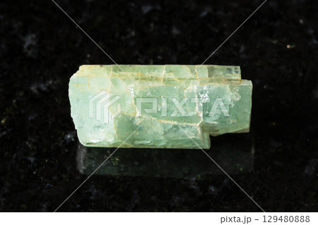 sample of raw green beryl crystal on black sample of raw green beryl crystal on black 129480888