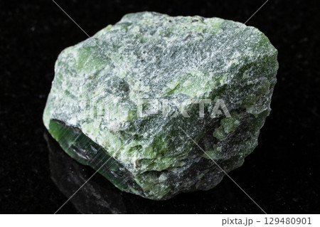 sample of raw green nephrite mineral on black sample of raw green nephrite mineral on black 129480901