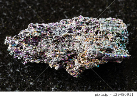 sample of raw carborundum mineral on black granite 129480911