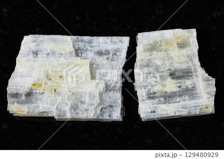 sample of raw eudidymite mineral on black granite sample of raw eudidymite mineral on black granite 129480929