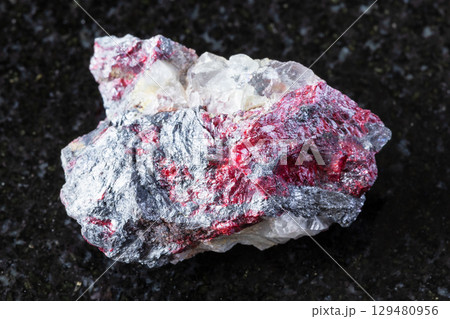 cinnabar, stibnite on fluorite mineral on black cinnabar, stibnite on fluorite mineral on black 129480956