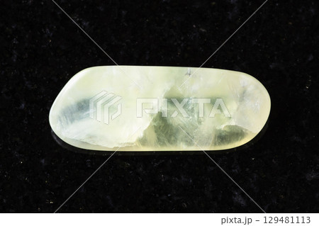 sample of tumbled vesuvianite rock on black 129481113