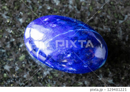 sample of polished lapis lazuli mineral on black 129481221